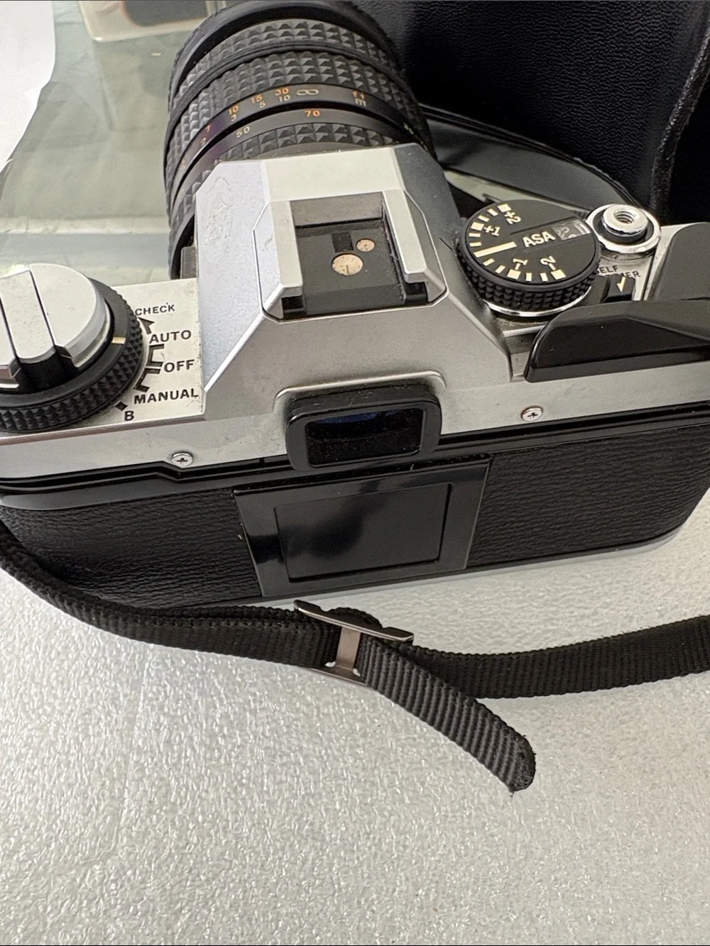 Olympus Silver and Black 35mm SLR Camera with Black Zoom Lens parts not tested